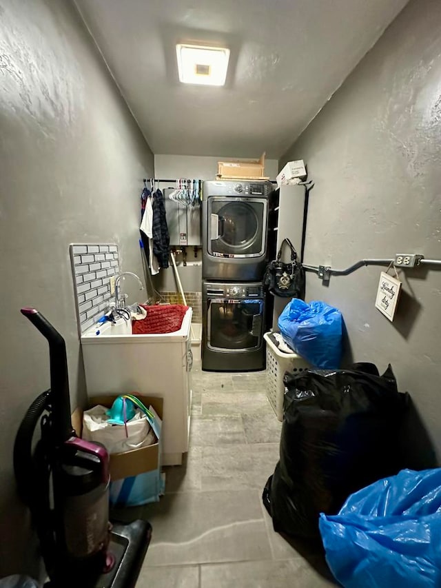 laundry area featuring stacked washer and dryer