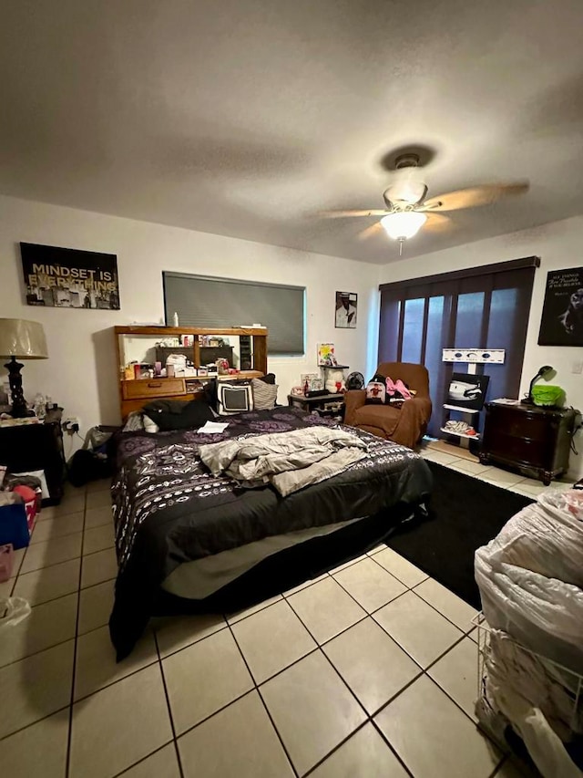 bedroom featuring ceiling fan and light tile patterned floors