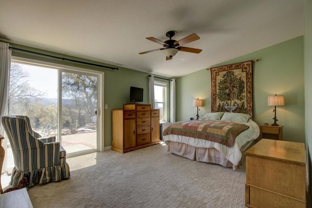 bedroom with access to outside, vaulted ceiling, ceiling fan, and carpet