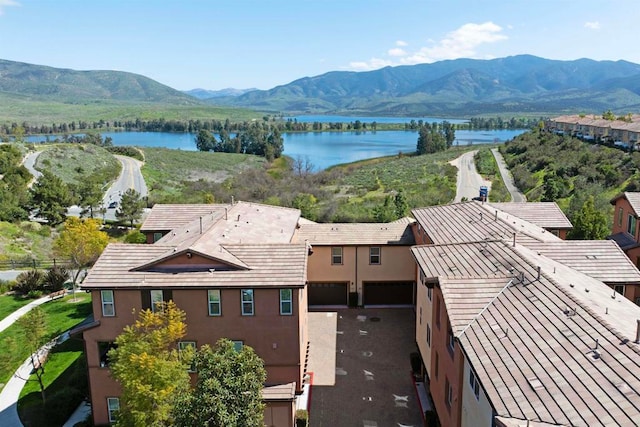 bird's eye view featuring a water and mountain view