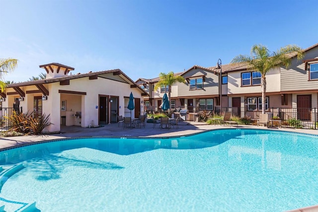 view of swimming pool with a patio