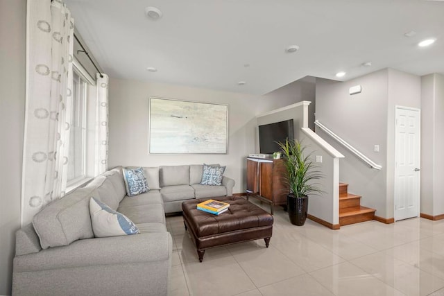 tiled living room with plenty of natural light