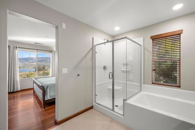 bathroom featuring plus walk in shower