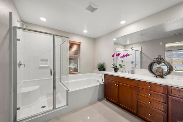 bathroom featuring separate shower and tub, tile patterned flooring, and vanity