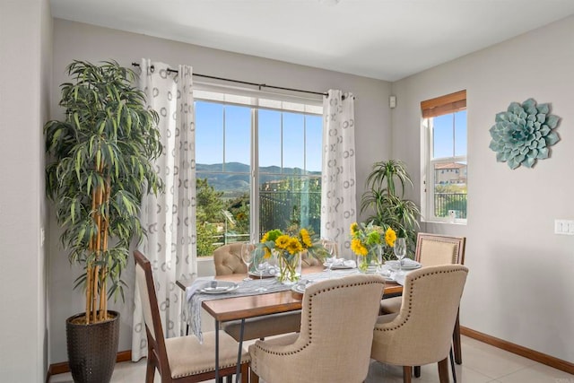 tiled dining area featuring a mountain view