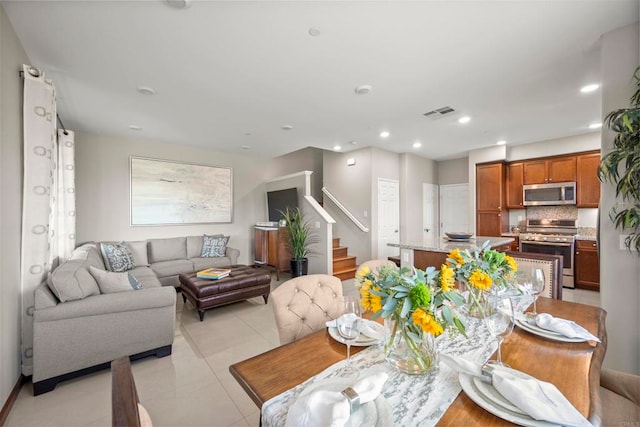 dining space with light tile patterned floors