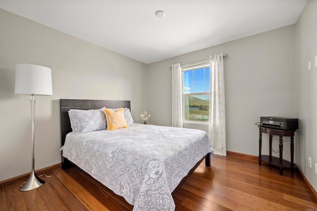 bedroom featuring dark hardwood / wood-style flooring