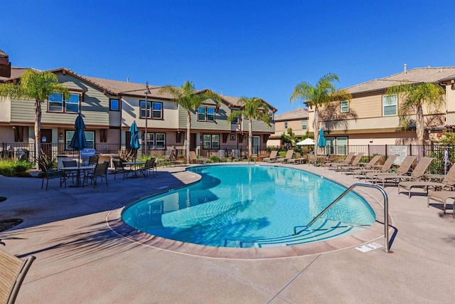 view of swimming pool with a patio area