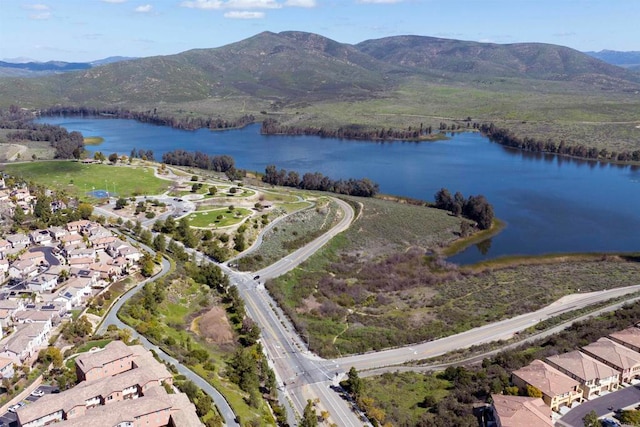 aerial view featuring a water and mountain view