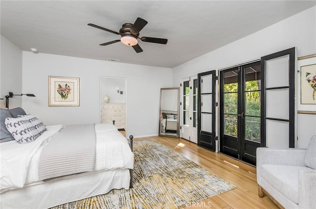 bedroom with ceiling fan, light hardwood / wood-style flooring, and french doors