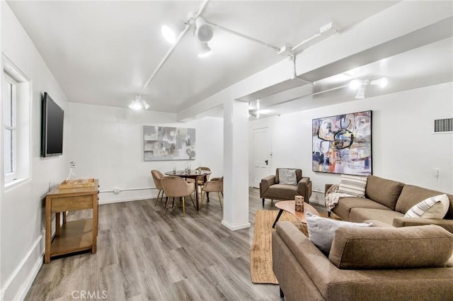 living room with light wood-type flooring and ceiling fan