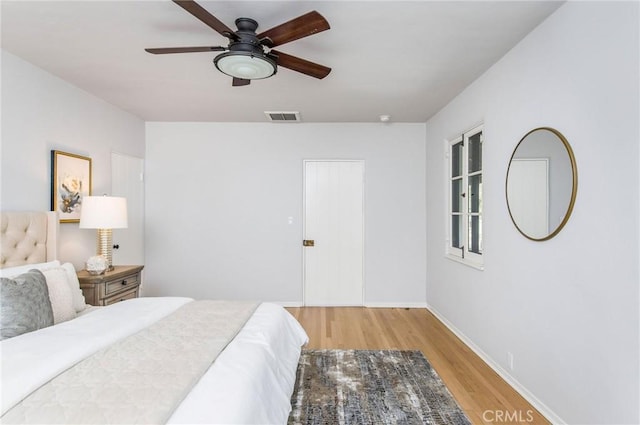 bedroom featuring light hardwood / wood-style floors and ceiling fan