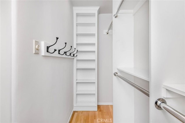 walk in closet featuring hardwood / wood-style floors