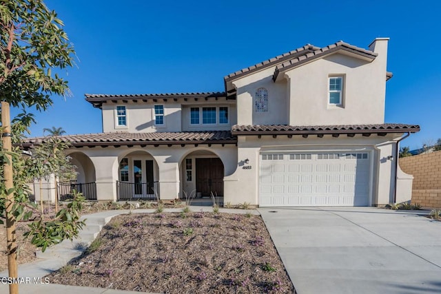 mediterranean / spanish-style house featuring a garage