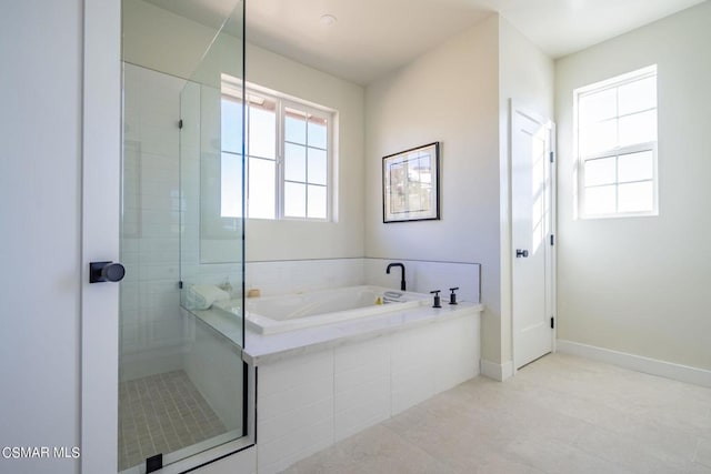 bathroom featuring shower with separate bathtub and tile patterned floors