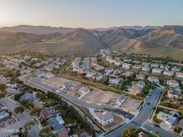 aerial view at dusk with a mountain view