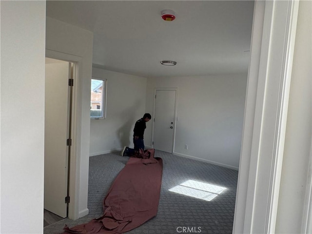 hallway featuring light carpet