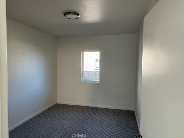 spare room with carpet flooring