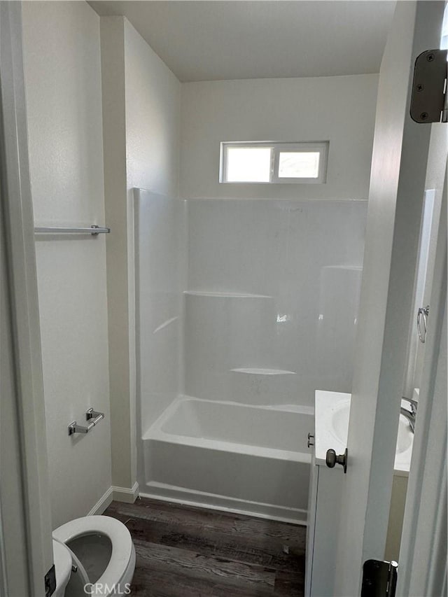 full bathroom with vanity, wood-type flooring, shower / washtub combination, and toilet