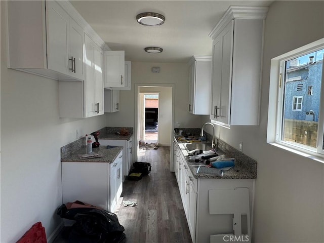 kitchen featuring white cabinetry and plenty of natural light