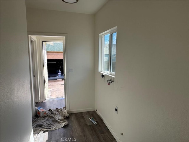 laundry room with dark wood-type flooring and hookup for an electric dryer