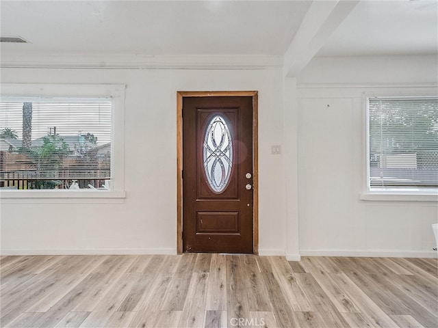 143 N Hobart Blvd, Los Angeles, CA 90004 - foyer with light hardwood / wood-style flooring, beamed ceiling, and a wealth of natural light