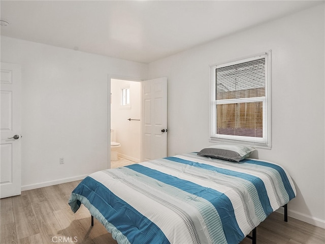 143 N Hobart Blvd, Los Angeles, CA 90004 - bedroom featuring light hardwood / wood-style floors and ensuite bath