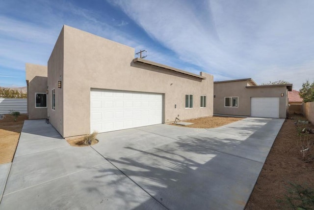 adobe home featuring a garage