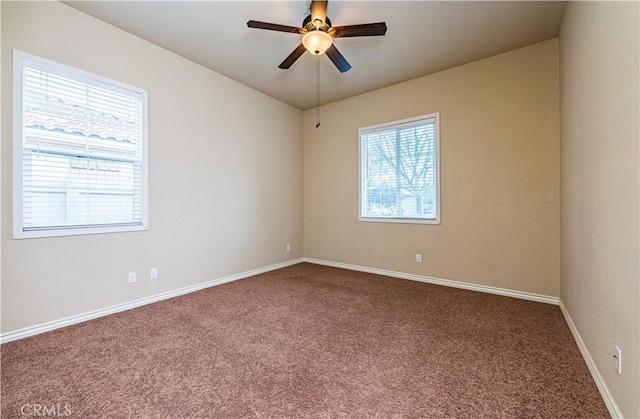 unfurnished room with carpet and ceiling fan