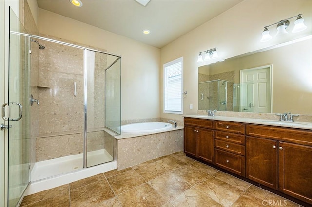 bathroom with tile patterned flooring, vanity, and separate shower and tub