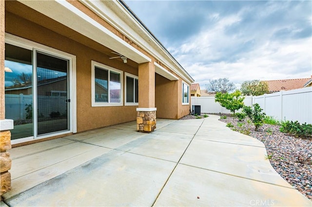 view of side of property with a patio area