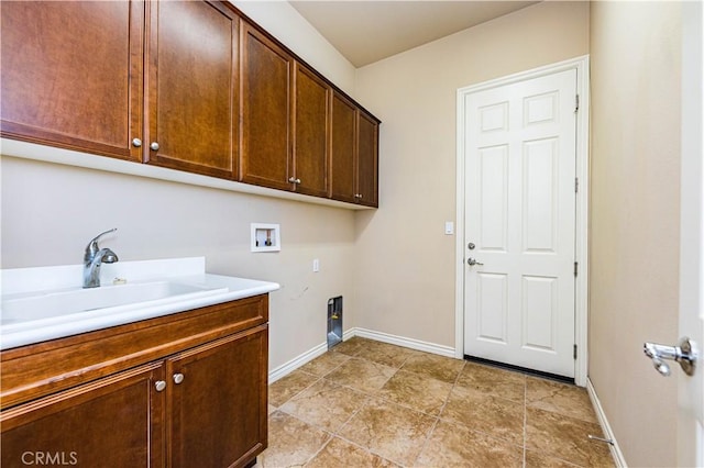 laundry area with cabinets, hookup for an electric dryer, sink, and washer hookup