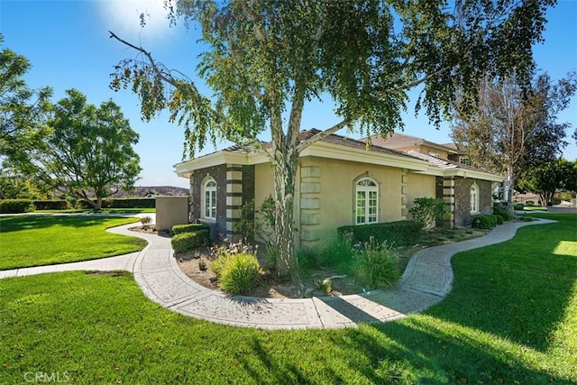 view of home's exterior with a lawn