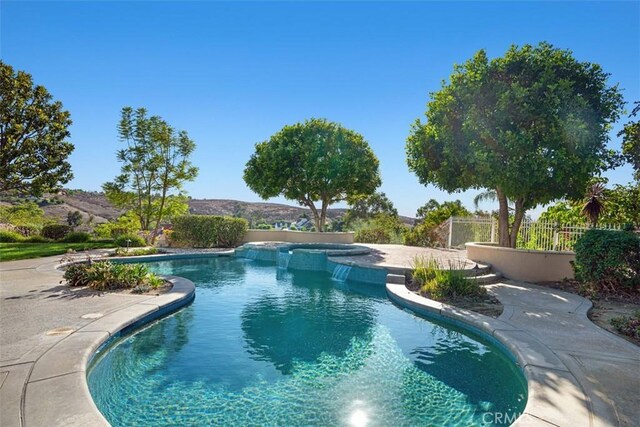 view of swimming pool featuring a mountain view