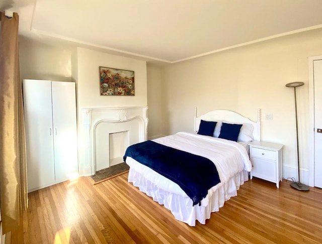 bedroom with hardwood / wood-style floors