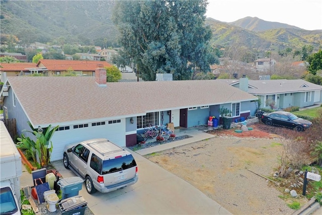 ranch-style home with a mountain view