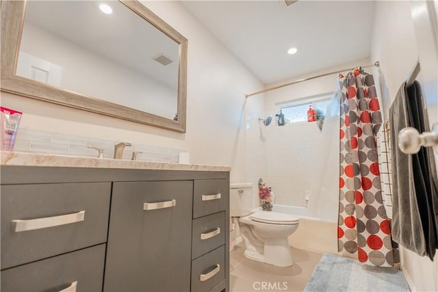 full bathroom featuring shower / tub combo with curtain, vanity, and toilet