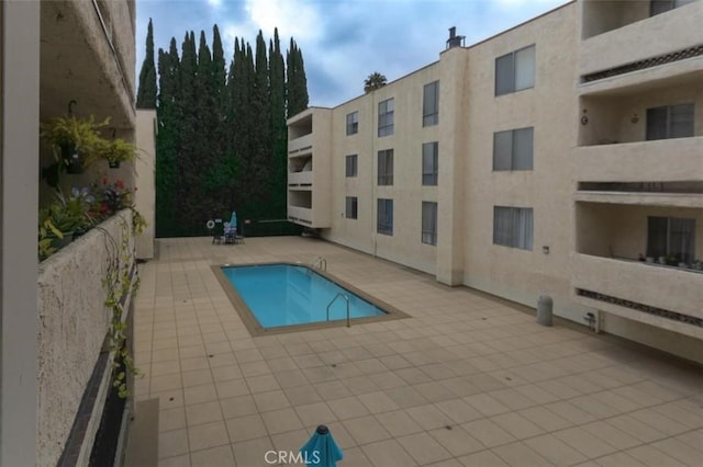 view of swimming pool with a patio area