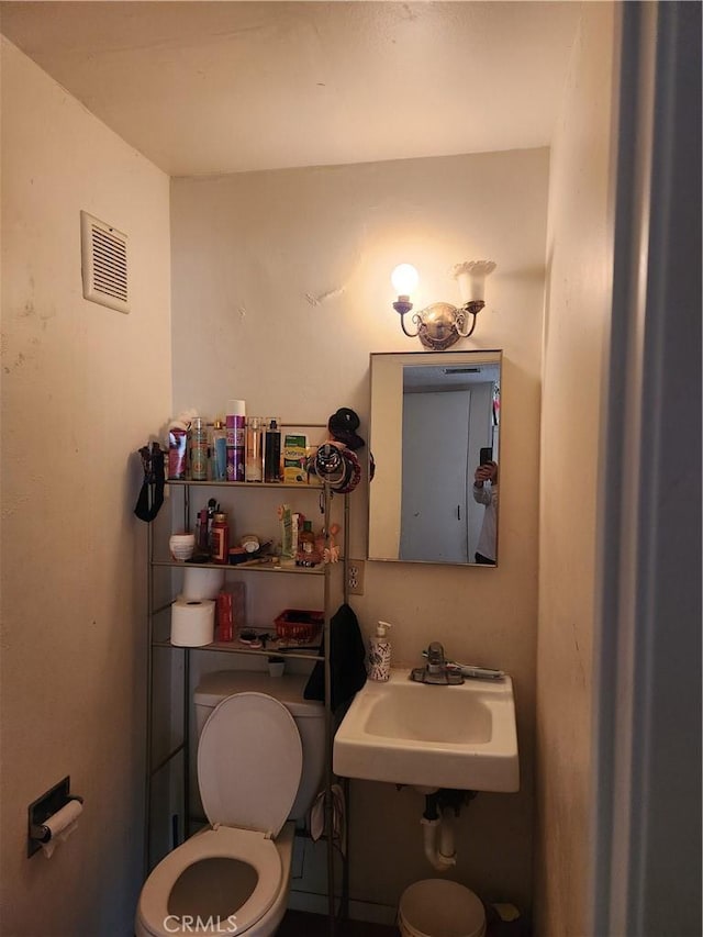 bathroom with toilet and sink