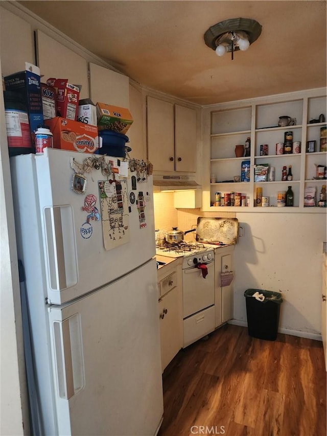 kitchen featuring white cabinetry, dark hardwood / wood-style flooring, white appliances, and decorative backsplash