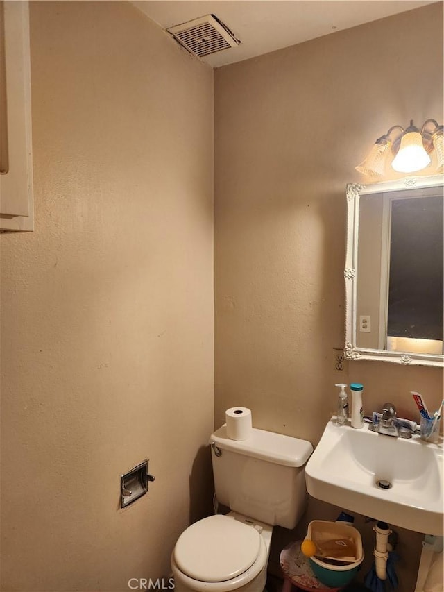 bathroom with toilet and sink