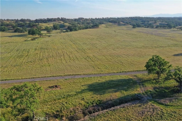 birds eye view of property with a rural view