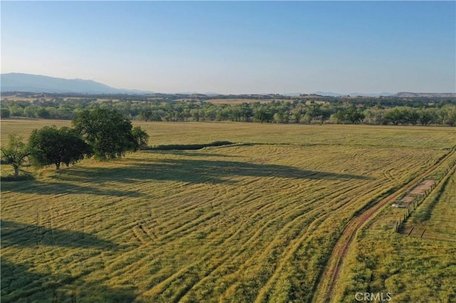 aerial view featuring a rural view and a mountain view