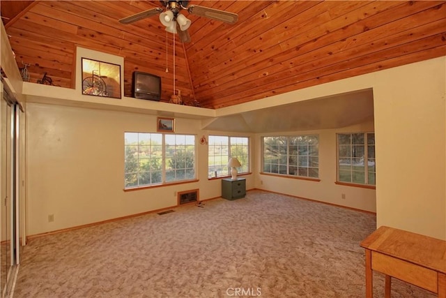 interior space featuring ceiling fan, high vaulted ceiling, and carpet flooring