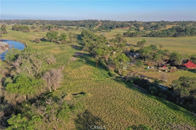 bird's eye view with a water view and a rural view