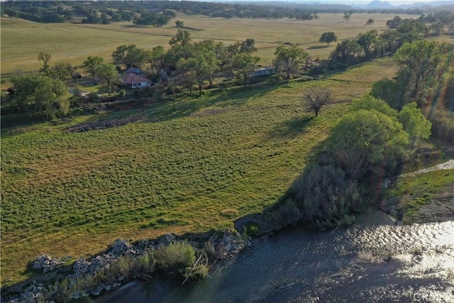 bird's eye view featuring a rural view and a water view