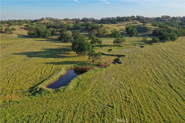 aerial view with a rural view and a water view