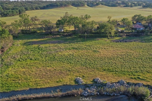 birds eye view of property with a rural view