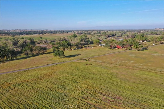 birds eye view of property with a rural view