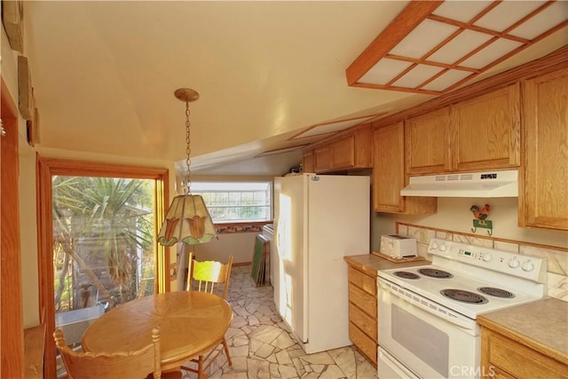 kitchen with decorative light fixtures, white appliances, and lofted ceiling